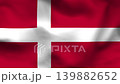 Denmark national flag on wavy fabric, top view. Realistic red textile texture featuring the white Scandinavian cross. 139882652