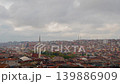 Timelapse: moving grey clouds in the snowy sky over typical turkish apartment 139886909