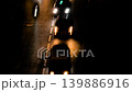 Timelapse: dark street with moving unrecognizable cars with headlights on, night 139886916