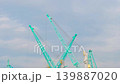 Timelapse: harbor cranes during work against cloudy sky in the sea port 139887020