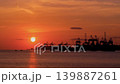 Timelapse: amazing dramatic sunset over the sea, cargo port in the evening 139887261