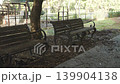 Tokyo.Japan-October 23.2019: The view of the side of the park where fallen leaves are scattered on the ground after the storm in Tokyo. Park bench 139904138