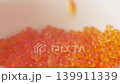 Falling red caviar closeup macro view 139911339