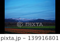 View of Mt. Asahi from the tulip fields of the "Spring Quartet" at Asahi Funakawa under the setting sun. 139916801