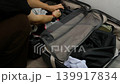 Happy Asian traveler packing luggage in bedroom before journey, vacation planning lifestyle theme 139917834