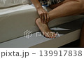 Asian woman suffering from ankle pain while massaging muscles, healthcare and fatigue recovery idea 139917838