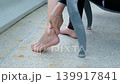 Asian woman suffering from ankle pain while massaging muscles, healthcare and fatigue recovery idea 139917841