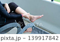 Asian woman suffering from ankle pain while massaging muscles, healthcare and fatigue recovery idea 139917842