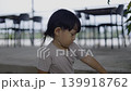 Toddler Boy Playing With Toy Car In Potting Soil At The Garden, child exploring nature, footage for family lifestyle marketing campaign, brand awareness, parenting and childhood documentary. 139918762
