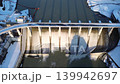 A panoramic view of the snow-covered Shimizusawa Dam in Yubari City, Hokkaido, at dusk. 139942697