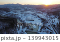 Shimizu-zawa Thermal Power Plant in Yubari City, Hokkaido, at dusk, with snow piled up on the ground. 139943015