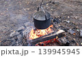 boiling water in saucepan outdoors 139945945
