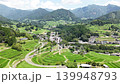 Aerial footage of the mountain village and terraced rice fields in Takachiho Town, Miyazaki Prefecture, where the Ama-no-Iwato Shrine is located. 139948793