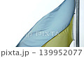 Up-throw of the Ukrainian flag fluttering in the wind 139952077
