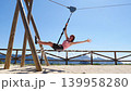 Adult woman having fun on zipline 139958280