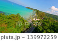 Cinematic FPV drone flight over tropical turquoise sea and white sandy beach in Thailand. Aerial view of crystal clear water, tropical coastline, and paradise island scenery. 139972259