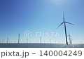 Wind turbines produce energy in the north sea, wind farm power plant view from height, green energy and alternative energy sources. 140004249