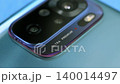 Macro close up of a smartphone camera lens on back 140014497