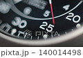 Macro close up of an automatic mechanical field watch with moving arms 140014498