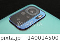 Macro close up of a smartphone camera lens on back 140014500