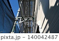 Exterior wall repair work on a detached house; new siding; looking up. Exterior wall repair work on a detached house; new siding; looking up. 140042487