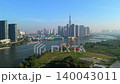 Aerial view of Ho Chi Minh City skyline with modern skyscrapers, Saigon River, waterfront developments and urban landscape in Vietnam on a clear sunny day. 140043011