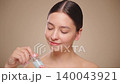 Beauty woman holding bottle with serum for skin care 140043921