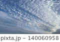 Time-lapse video of cirrocumulus clouds spreading across a blue sky (fixed-point footage) 140060958