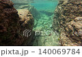 Underwater photography: Macro footage of an ecosystem moving around near coral (sponge) on the seabed. 140069784