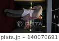 Romantic evening for a married couple. A man carries his beloved woman in his arms in the sad evening light 140070691