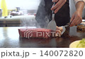 Professional Chef Cooking Wagyu Beef Steak on Teppanyaki Grill in Japanese Restaurant 140072820