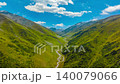 dolly backwards drone hyperlapse in green mountains of Kyrgyzstan at sunny summer day 140079066