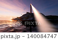 lighthouses scanning the coast at sunset and at night 140084747