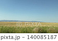 Driving plate distance view of beautiful Besparmak or Girne mountains also known as Kyrenia mountain range in Cyprus. Wide dry yellow summer field landscape. 140085187