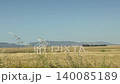 Driving plate distance view of beautiful Besparmak or Girne mountains also known as Kyrenia mountain range in Cyprus. Wide dry yellow summer field landscape. 140085189