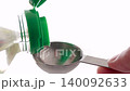 Measure the liquid seasonings using a measuring spoon. 140092633