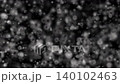 Large dust particles drifting slowly in dark background 140102463