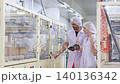Two technician inspecting automated machinery in food industry. 140136342