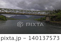 Drone backward and upward reveal from the Ballachulish Bridge, showcasing the steel span 140137573