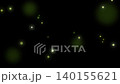 Dreamlike firefly-like lights and particles floating against a dark background 140155621