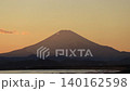 The silhouette of Mount Fuji bathed in the setting sun - Evening Scenery 140162598