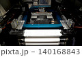 Automated stencil printer applying solder paste onto PCB in SMT production line for electronics assembly 140168843