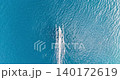 Top Down Drone View of Traditional Boat Cutting Through Blue Ocean in Bali 140172619
