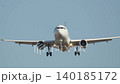 Passenger airplane lands at airport runway during clear weather showcasing air travel and tourism experience 140185172