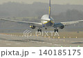 Aircraft approach and landing on runway during overcast weather at regional airport 140185175