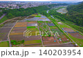 Aerial view of a large rice paddy filled with water. 140203954