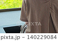 A woman enjoying a footbath while admiring the spectacular view. 140229084