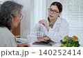 Asian woman nutritionist doctor discussing medical treatment with senior patient. 140252414