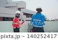 Electrician working on electrical system maintenance on rooftop. 140252417