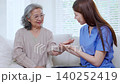 Asian woman nurse examining senior patient arm pain for physical therapy and rehabilitation. 140252419